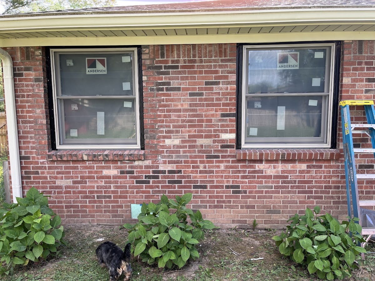 Brick repaired and matched around two exterior windows to blend with the original wall